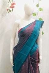 Peacock blue dual tone Banarasi silk saree with a contrasting designer border, comes with a running blouse piece.