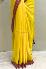 Bright Yellow Mul Cotton Saree with Purple and Golden zari Border